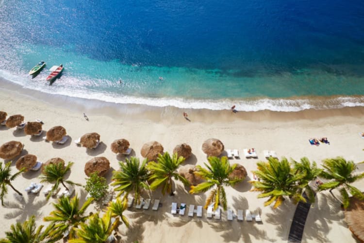 Aerial of beach and loungers